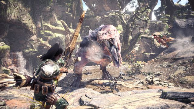 This screenshot from Monster Hunter: World shows a player character with a bow aiming at a massive monster called an Anjanath. Behind the creature is a massive canyon full of vines and ragged trees.