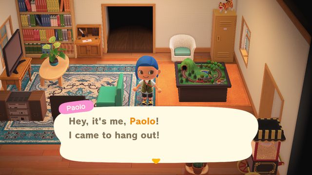 An Animal Crossing player being visited in their home by Paolo