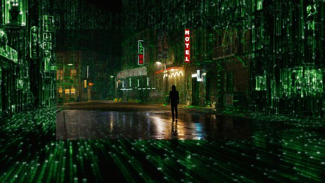 Thomas Anderson walks through a city street as it devolves into code in The Matrix Resurrections.
